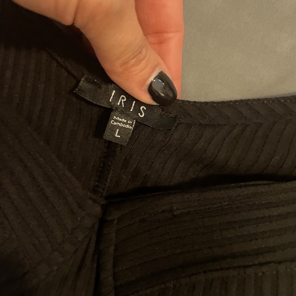 Body suite NEVER WORN . Tags still attached. Pure black in color
